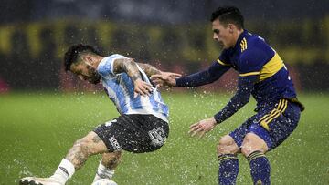 BUENOS AIRES, ARGENTINA - AUGUST 08: Elias Gomez of Argentinos Juniors fights for the ball with Christian Pavon of Boca Juniors during a match between Boca Juniors and Argentinos Juniors as part of Torneo Liga Profesional 2021 at Estadio Alberto J. Arma