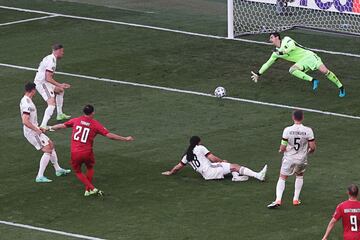 Denmark's forward Yussuf Poulsen (3rd-L) shoots and scores a goal during the UEFA EURO 2020 Group B football match between Denmark and Belgium at the Parken Stadium in Copenhagen on June 17, 2021. (Photo by HANNAH MCKAY / POOL / AFP)