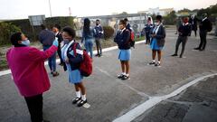 FILE PHOTO: A teacher screens students as schools begin to reopen after the coronavirus disease (COVID-19) lockdown in Langa township in Cape Town, South Africa June 8, 2020. Picture taken June 8, 2020. REUTERS/Mike Hutchings/File Photo