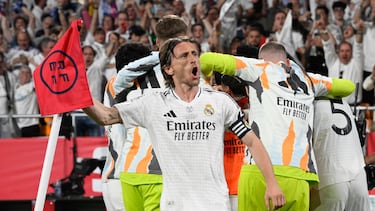 (FILES) Real Madrid's Croatian midfielder #10 Luka Modric and teammates celebrate their second goal scored by Real Madrid's French midfielder #14 Aurelien Tchouameni during their Spanish Cup, Copa del Rey (King's Cup) final football match between FC Barcelona and Real Madrid CF at La Cartuja stadium in Seville on April 26, 2025. Real Madrid's Croatian midfielder Luka Modric said on May 22, 2025 he would leave the Spanish giants after the Club World Cup this summer. (Photo by Josep LAGO / AFP)