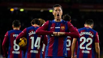 Barcelona's Polish forward #09 Robert Lewandowski celebrates after scoring his team's first goal during the Spanish league football match between FC Barcelona and Girona FC at the Estadi Olimpic Lluis Companys in Barcelona on December 10, 2023. (Photo by Pau BARRENA / AFP)