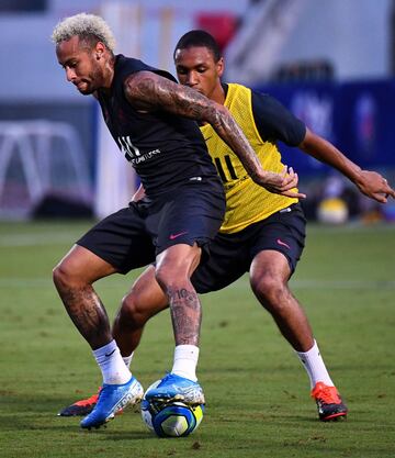 Paris Saint-Germain's Brazilian forward Neymar (L) fights for the ball with Paris Saint-Germain's French defender Abdou Diallo during a training session at The Xixiang Sports Centre in Shenzhen on August 1, 2019, ahead of the French Trophy of Champions fo
