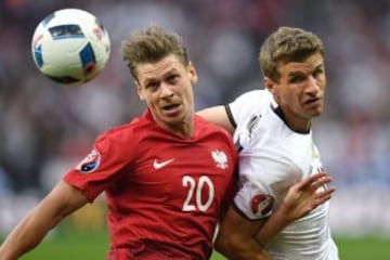 Thomas Mueller con Lukasz Piszczek.