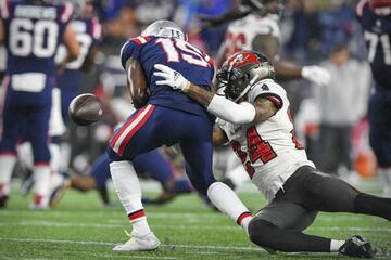 Oct 3, 2021; Foxboro, MA, USA; Tampa Bay Buccaneers cornerback Carlton Davis (24) forces the ball out against New England Patriots wide receiver Nelson Agholor (15) during the first quarter at Gillette Stadium. Mandatory Credit: Brian Fluharty-USA TODAY S