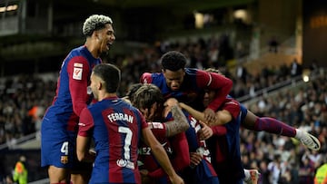 Barcelona's Spanish forward #38 Marc Guiu celebrates with teammates after scoring his team's first goal during the Spanish league football match between FC Barcelona and Athletic Club Bilbao at the Estadi Olimpic Lluis Companys in Barcelona on October 22, 2023. (Photo by Josep LAGO / AFP)