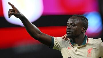Liverpool's Senegalese striker Sadio Mane celebrates scoring the team's second goal during the English Premier League football match between Aston Villa and Liverpool at Villa Park in Birmingham, central England on May 10, 2022. (Photo by Paul E