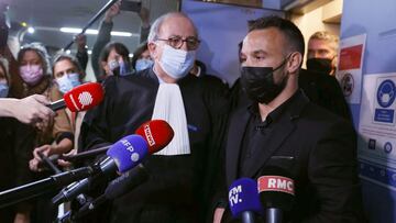 France&#039;s football player Mathieu Valbuena (R), involved in a &#039;sex tape case&#039;, addresses media representatives next to lawyer Paul Albert Iweins (C) inside a court at the end of the hearing in Versailles, west of Paris on October 20, 2021, o