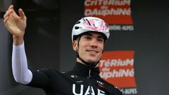 Team UAE's Spanish rider Juan Ayuso waves before the start of the second stage of the 76th edition of the Criterium du Dauphine cycling race, 142km between Gannat and Col de la Loge, near La Chamba, central France, on June 3, 2024. (Photo by Thomas SAMSON / AFP)