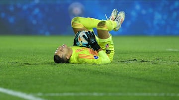 Independiente Medellin's goalkeeper Eder Chaux gestures on the ground after catching the ball during the Copa Sudamericana quarter-final first leg football match between Argentina's Lanus and Colombia's Independiente Medellin at the Ciudad de Lanus stadium in Lanus, Buenos Aires province, Argentina, on September 18, 2024. (Photo by JUAN MABROMATA / AFP)