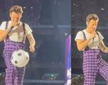 WATCH: Harry Styles shows off soccer skills on stage
