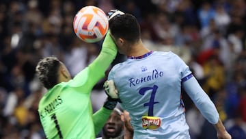 Riyadh All-Star's Portuguese forward Cristiano Ronaldo (R)collides with Paris Saint-Germain's Costa Rican goalkeeper Keylor Navas (L) during the Riyadh Season Cup football match between the Riyadh All-Stars and Paris Saint-Germain at the King Fahd Stadium in Riyadh on January 19, 2023. (Photo by Giuseppe CACACE / AFP)