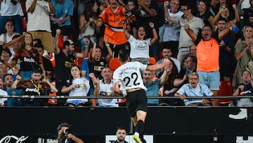 Valencia's French midfielder #22 Baptiste Santamaria celebrates after scoring their first goal during the Spanish league football match between Valencia CF and Athletic Club Bilbao at the Mestalla stadium in Valencia, on September 20, 2025. (Photo by Jose Jordan / AFP)