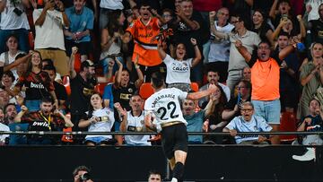 Valencia's French midfielder #22 Baptiste Santamaria celebrates after scoring their first goal during the Spanish league football match between Valencia CF and Athletic Club Bilbao at the Mestalla stadium in Valencia, on September 20, 2025. (Photo by Jose Jordan / AFP)
