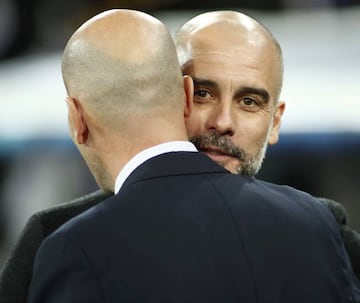 Pep Guardiola embraces Zinedine Zidane during the first leg at the Bernabeu.