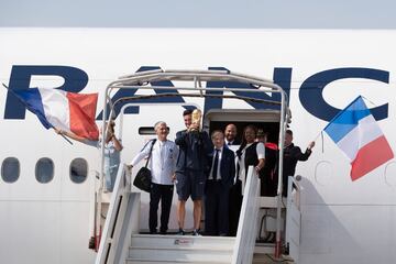 French national soccer team head coach Didier Deschamps, Goalkeeper Hugo Lloris, President of the French Football Federation (FFF) Noel Le Graet are welcomed by French minister of sport Laura Flessel as they arrive by plane with the team at Roissy Charles