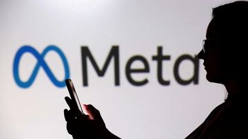 FILE PHOTO: A teenager poses for a photo while holding a smartphone in front of a Meta logo in this illustration taken September 11, 2025. REUTERS/Dado Ruvic/Illustration//File Photo