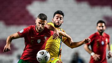 Portugal's defender Domingos Duarte (L) vies with Andorra's midfielder Jordi Alaez during the international friendly football match between Portugal and Andorra at the Luz stadium in Lisbon on November 11, 2020. (Photo by PATRICIA DE MELO MOREIRA / AFP)