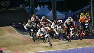 (From L) US' #233 Kamren Larsen, Switzerland's #149 Cedric Butti, France's #03 Sylvain Andre, Chile's #07 Mauricio Molina Vergara, New Zealand's #06 Rico Bearman, Switzerland's #179 Simon M. Marquart, Netherlands' #239 Jaymio Brink and Thailand's #260 Komet Sukprasert compete in the second heat of the third run of the Men's Cycling BMX Racing quarterfinals during the Paris 2024 Olympic Games in Saint-Quentin-en-Yvelines, on August 1, 2024. (Photo by Mauro PIMENTEL / AFP)