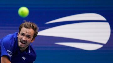 (FILES) In this file photo taken on September 10, 2021, Russia's Daniil Medvedev hits a return to Canada's Felix Auger-Aliassime during their 2021 US Open Tennis tournament men's semifinal match at the USTA Billie Jean King National Tennis Center in New York. - The 2022 US Open will award a record $60.1 million in total player compensation, the US Tennis Association said on August 18, 2022, with $2.6 million going to each singles champion, twice the runner-up total. The prize money total tops the old mark of $57.5 million from 2021, with an emphasis on boosting payouts for players in early rounds. (Photo by TIMOTHY A. CLARY / AFP)