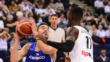 19 August 2022, Hamburg: Basketball; Supercup, Germany - Czech Republic, semifinal at Barclaycard Arena. Czech Republic's Tomas Satoransky (l) and Germany's Dennis Schr?der fight for the ball. Photo: Daniel Bockwoldt/dpa (Photo by Daniel Bockwoldt/picture alliance via Getty Images)
