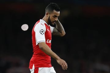 Arsenal's English midfielder Theo Walcott leaves the pitch after losing 5-1 during the UEFA Champions League last 16