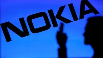 FILE PHOTO: A photo illustration of a man silhouetted against a Nokia logo in the central Bosnian town of Zenica January 23, 2014. REUTERS/Dado Ruvic/File Photo