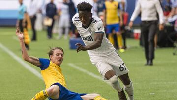 Jul 1, 2018; Vancouver, British Columbia, CAN; Vancouver Whitecaps forward Alphonso Davies (67) takes the ball up field during the second half after getting past Colorado Rapids forward Joe Mason (10) at BC Place. Colorado Rapids won 1-0. Mandatory Credit