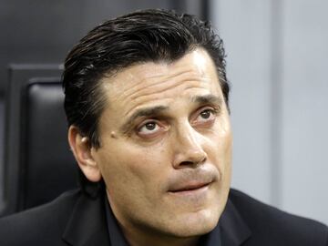 AC Milan coach Vincenzo Montella watches his players prior to a Serie A soccer match between AC Milan and Juventus, at the Milan San Siro stadium, Italy, Saturday, Oct. 28, 2017.
