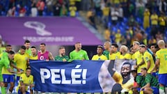 DOHA, QATAR - DECEMBER 05: Brazil players hold a banner showing support for former Brazil player Pele after the FIFA World Cup Qatar 2022 Round of 16 match between Brazil and South Korea at Stadium 974 on December 05, 2022 in Doha, Qatar. (Photo by Justin Setterfield/Getty Images)