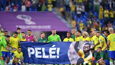 DOHA, QATAR - DECEMBER 05: Brazil players hold a banner showing support for former Brazil player Pele after the FIFA World Cup Qatar 2022 Round of 16 match between Brazil and South Korea at Stadium 974 on December 05, 2022 in Doha, Qatar. (Photo by Justin Setterfield/Getty Images)