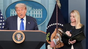 U.S. President Donald Trump speaks to the media as U.S. Attorney General Pam Bondi listens, after the U.S. Supreme Court dealt a blow to the power of federal judges by restricting their ability to grant broad legal relief in cases as the justices acted in a legal fight over President Donald Trump's bid to limit birthright citizenship, in the Press Briefing Room at the White House in Washington D.C., June 27, 2025. REUTERS/Ken Cedeno