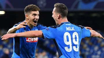 Napoli&#039;s Polish forward Arkadiusz Milik celebrates with Napoli&#039;s Italian defender Giovanni Di Lorenzo (L) after scoring his second goal during the UEFA Champions League Group E football match Napoli vs Genk on December 10, 2019 at the San Paolo 