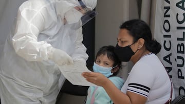 Medical staff attend to a mother and daughter outside the T-III Dr. Juan Duque de Estrada Health Centre in Mexico City. (Photo by Gerardo Vieyra/NurPhoto via Getty Images)