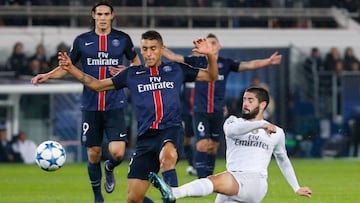 Real Madrid's Spanish midfielder Isco (R) vies with Paris Saint-Germain's Brazilian defender Marquinhos during the UEFA Champions League football match