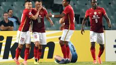 Guangzhou Evergrande player Huang Bowen (2/L) is congratulated by teammates after scoring against Sydney FC during their AFC Champions League group stage football match in Sydney on March 2, 2016.