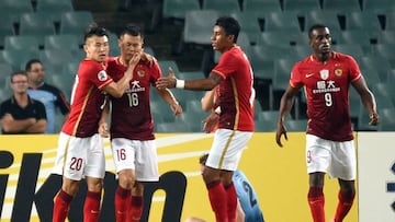 Guangzhou Evergrande player Huang Bowen (2/L) is congratulated by teammates after scoring against Sydney FC during their AFC Champions League group stage football match in Sydney on March 2, 2016.