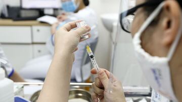 Hanoi (Viet Nam), 17/03/2021.- A health worker prepares a shot of COVID-19 vaccine developed by AstraZeneca at a vaccination center of the Vietnam Vaccine Joint Stock Company (VNVC), in Hanoi, Vietnam 17 March 2021. Major European countries have temporari