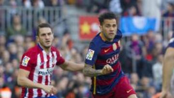 Koke y Dani Alves.