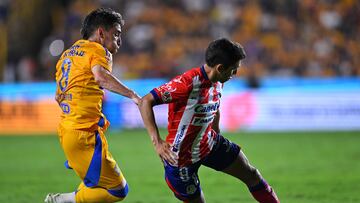 Fernando Gorriaran (L) of Tigres fights for the ball with Juan Sanabria (R) of San Luis during the 7th round match between Tigres UANL and Atletico San Luis as part of the Liga BBVA MX, Torneo Apertura 2024 at Universitario Stadium on September 13, 2024 in Monterrey, Nuevo Leon, Mexico.