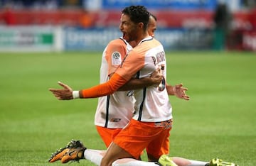 Montpellier teammates celebrate after Montpellier's Portuguese defender Pedro Mendes scored a goal during the French Ligue 1 football match between Troyes and Montpellier on September 16,