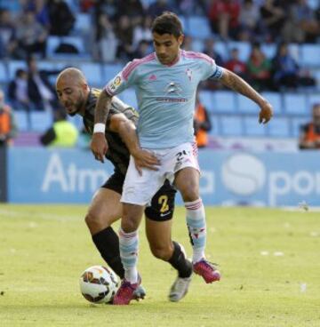 Augusto Fernández con Nordin Amrabat.