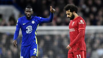 Soccer Football - Premier League - Chelsea v Liverpool - Stamford Bridge, London, Britain - January 2, 2022 Liverpool's Mohamed Salah looks dejected as Chelsea's Antonio Rudiger reacts REUTERS/Toby Melville EDITORIAL USE ONLY. No use with unauthorized audio, video, data, fixture lists, club/league logos or 'live' services. Online in-match use limited to 75 images, no video emulation. No use in betting, games or single club /league/player publications. Please contact your account representative for further details.