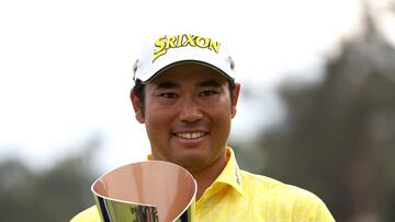 Hideki Matsuyama of Japan poses for a photo with the trophy after putting in to win on the 18th green during the final round of The Genesis Invitational at Riviera Country Club.