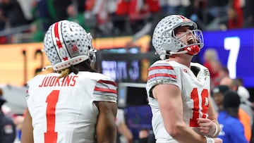 ATLANTA, GEORGIA - JANUARY 20: Will Howard #18 celebrates with Quinshon Judkins #1 of the Ohio State Buckeyes after a touchdown from Judkins during the third quarter against the Notre Dame Fighting Irish in the 2025 CFP National Championship at the Mercedes-Benz Stadium on January 20, 2025 in Atlanta, Georgia. Kevin C. Cox/Getty Images/AFP (Photo by Kevin C. Cox / GETTY IMAGES NORTH AMERICA / Getty Images via AFP)