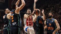 BELGRADE, SERBIA - MARCH 29: Facundo Campazzo (C) of Crvena Zvezda in action against Josep Puerto (L) and Jonah Radebaugh (R) of Valencia during the 2022-23 Turkish Airlines EuroLeague Regular Season Round 31 game between Crvena Zvezda mts Belgrade and Valencia Basket at Stark Arena on March 29, 2023 in Belgrade, Serbia. (Photo by Srdjan Stevanovic/Euroleague Basketball via Getty Images)