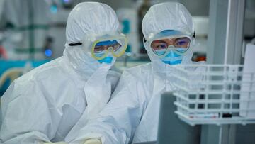 This photo taken on February 24, 2020 shows doctors working as they treat patients infected by the COVID-19 coronavirus at a hospital in Wuhan in China's central Hubei province. - The new coronavirus has peaked in China but could still grow into a pandemic, the World Health Organization warned, as infections mushroom in other countries. (Photo by STR / AFP) / China OUT (Photo by STR/AFP via Getty Images)