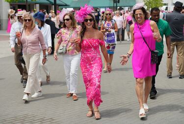 May 2, 2025; Louisville, KY, USA; Race fans walk around in their derby hats and attire for Oaks Day at Churchill Downs in Louisville, Ky. on May 2, 2025. Mandatory Credit: Sam Upshaw Jr./USA TODAY NETWORK via Imagn Images