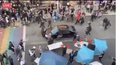 Man drives car into protest crowd and shoots demonstrator