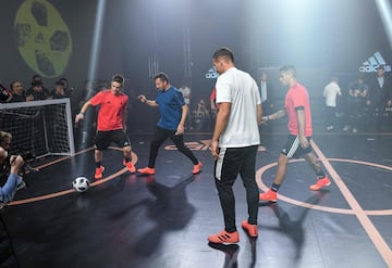 Lukas Podolski, Alessandro Del Piero along with other participants play with the official match ball for the 2018 World Cup football tournament, named "Telstar 18", during its unveiling ceremony in Moscow on November 9, 2017