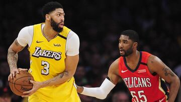 January 3, 2020; Los Angeles, California, USA; Los Angeles Lakers forward Anthony Davis (3) moves the ball against New Orleans Pelicans guard E'Twaun Moore (55) during the first half at Staples Center. Mandatory Credit: Gary A. Vasquez-USA TODAY Sports